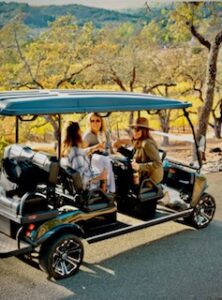 women in a golf cart in Napa
